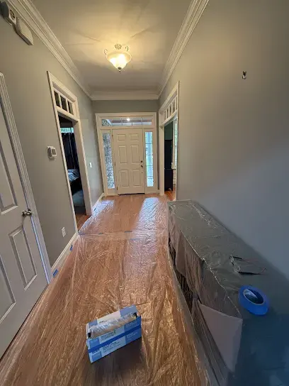 Air movers drying a room of a home during a water damage dry-out in Raleigh, NC